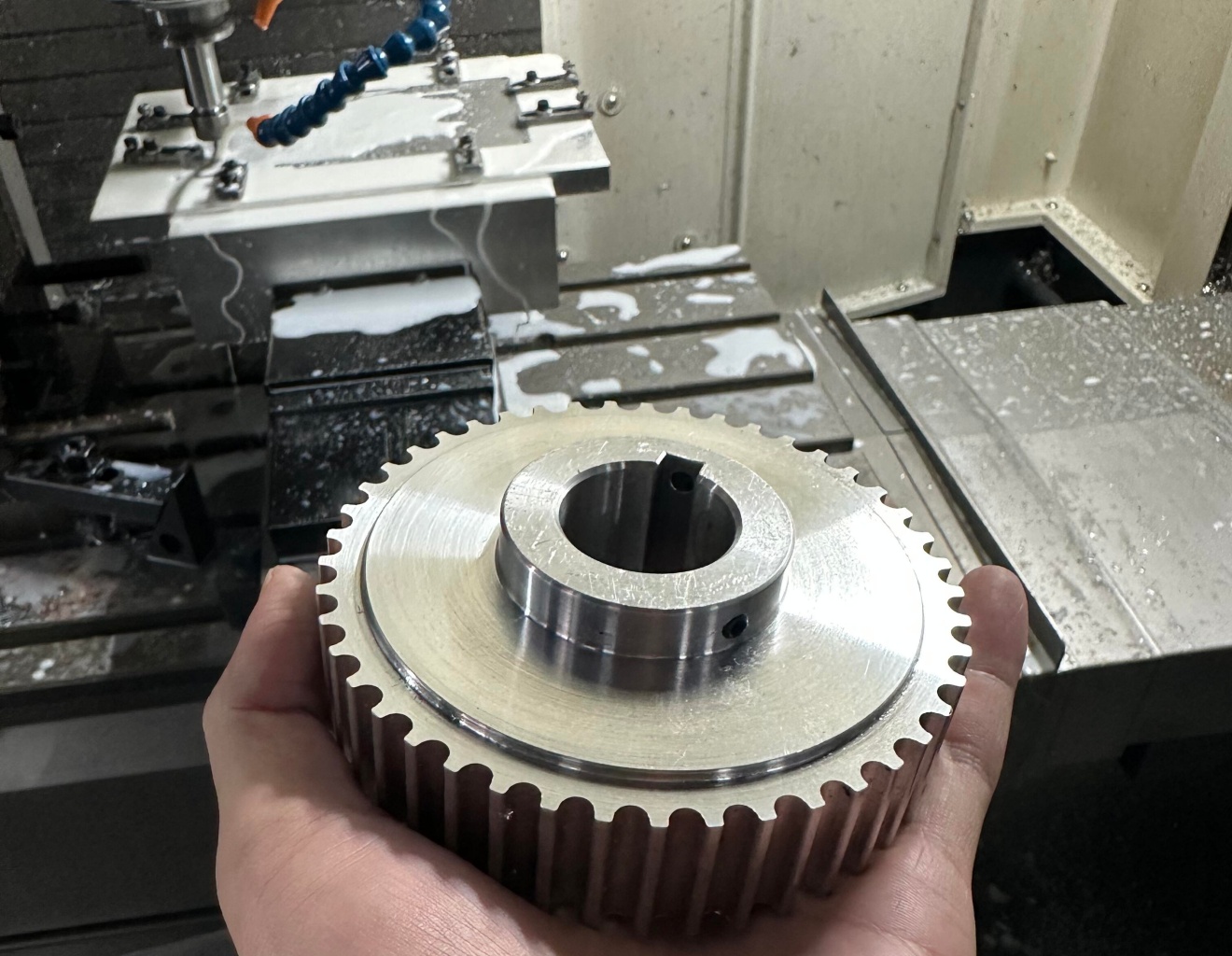 Finished CNC machined timing pulley after quality inspection in CNC machining workshop, custom gear machining